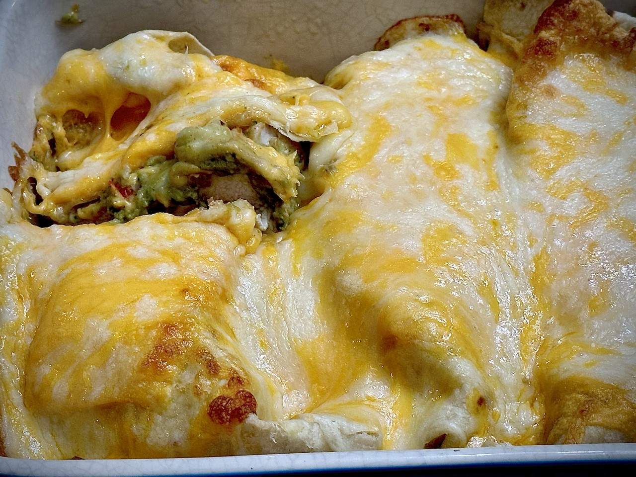 Cheesy Creamy Baked Chicken Burritos